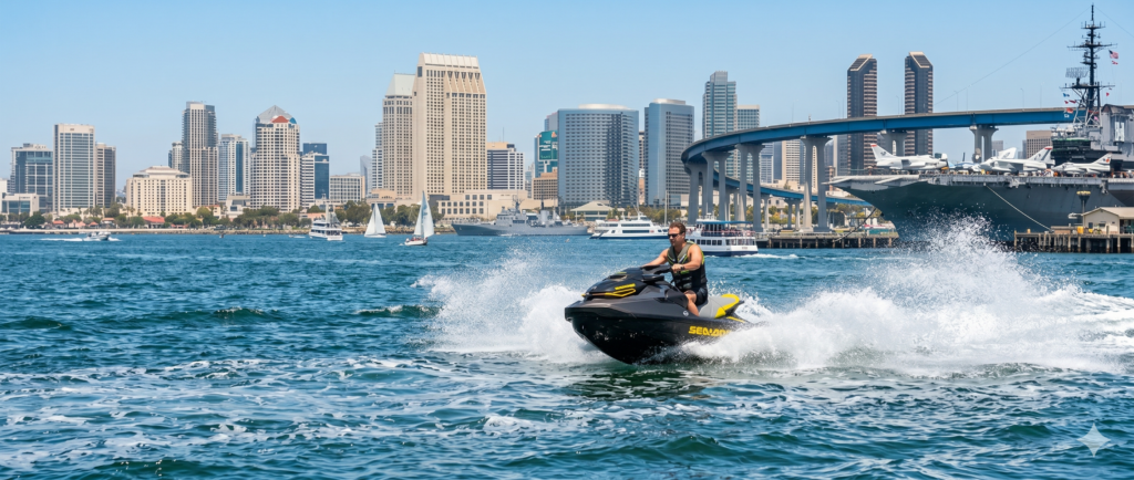 Jet ski rider on San Diego Bay with downtown skyline and Coronado Bridge views